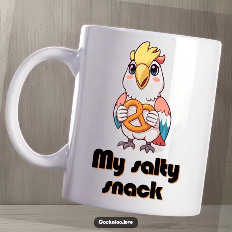 Funny cockatoo mug featuring a happy bird with a tiny pretzel held in its beak, showing pure snack satisfaction.
