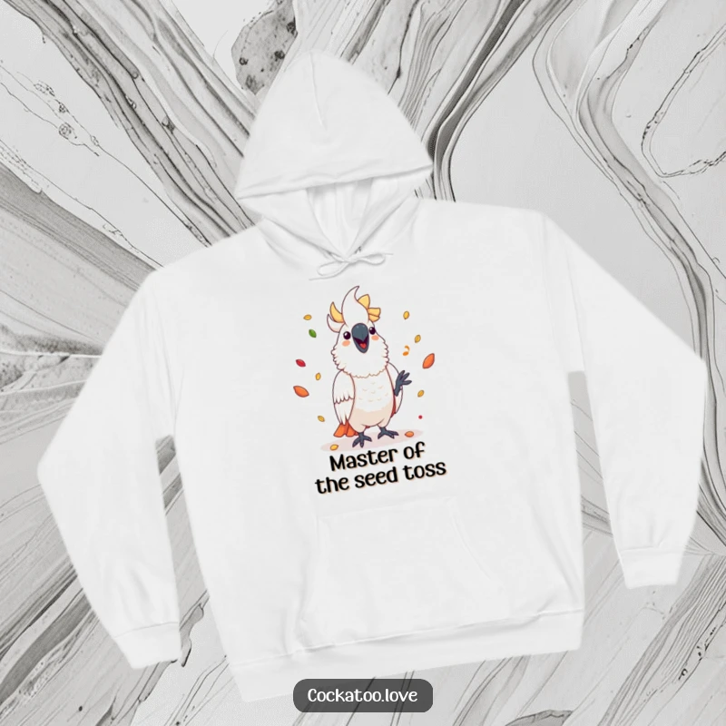 Funny cockatoo hoodie depicting a happy bird effortlessly juggling a cascade of colorful seeds, perfect for bird fans.