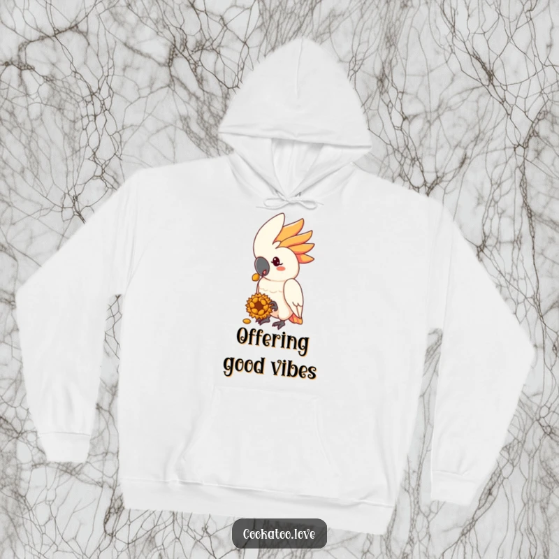 Funny cockatoo hoodie featuring a kind bird offering a sunflower seed treat, symbolizing generosity and warmth.