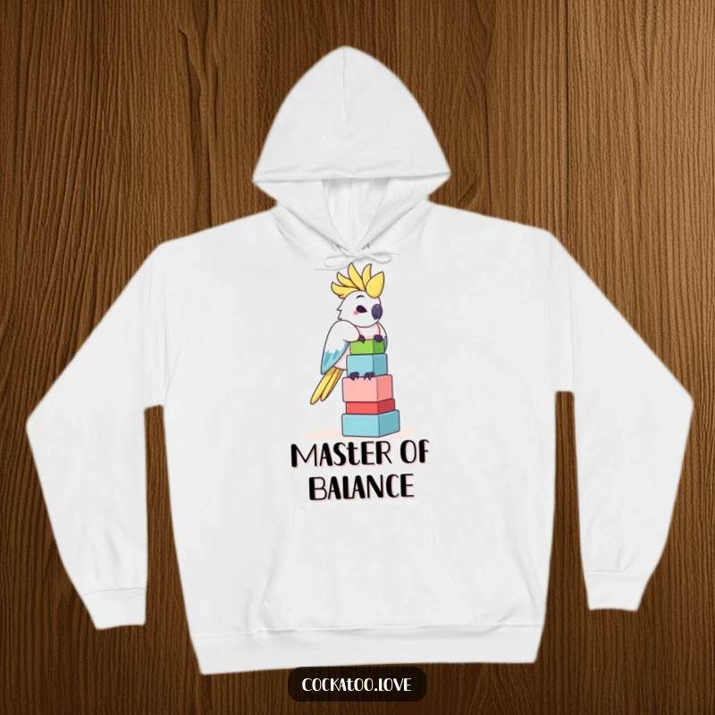 Funny Cockatoo Hoodie: A comical cockatoo is depicted balancing a precarious tower of colorful blocks, exuding playful concentration.