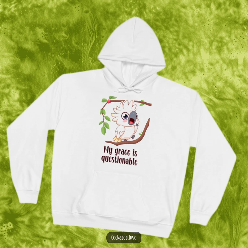 Funny hoodie featuring a surprised cockatoo with wide, shocked eyes, comically falling from a tree branch.