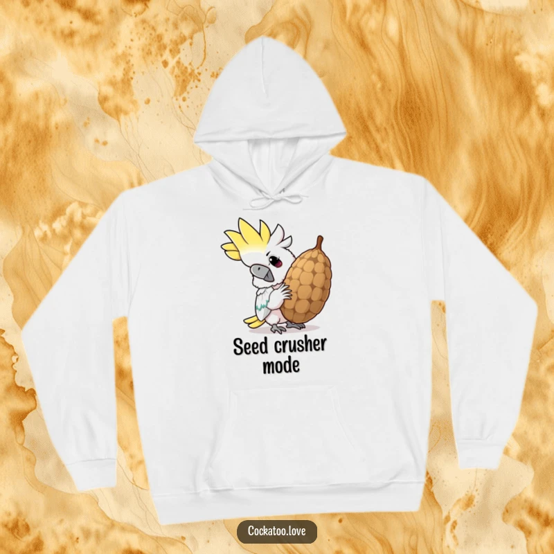 Funny cockatoo hoodie, determinedly cracking a large seed with a wide, funny grin, keeping the wearer warm and amused.