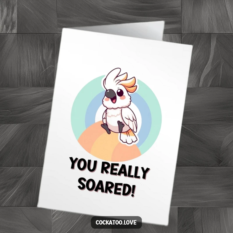 Free printable congratulations card showing a cockatoo gleefully descending a rainbow arc, symbolizing a fun and exciting achievement.