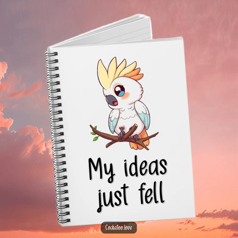 Funny notebook cover showing a surprised cockatoo with wide eyes, comically tumbling from a tree branch.