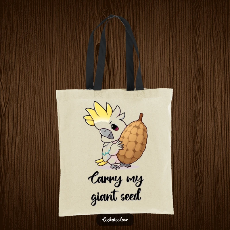 Funny cockatoo tote bag, depicting a determined bird cracking a giant seed with a comically wide grin, perfect for daily use.