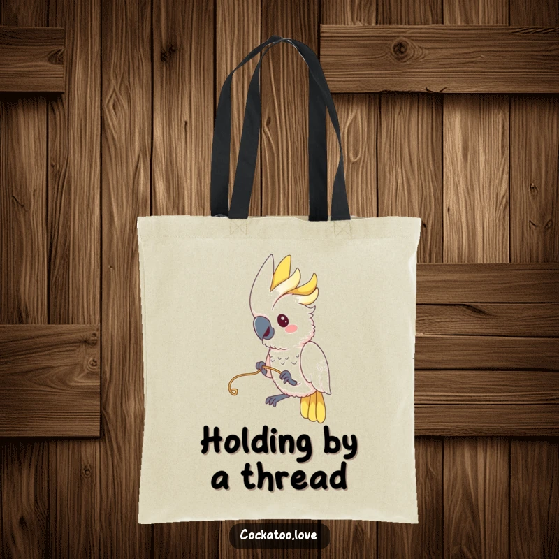 Funny Cockatoo Tote Bag: A cockatoo engages in a funny game, playfully tugging on a string, adding charm to this tote.